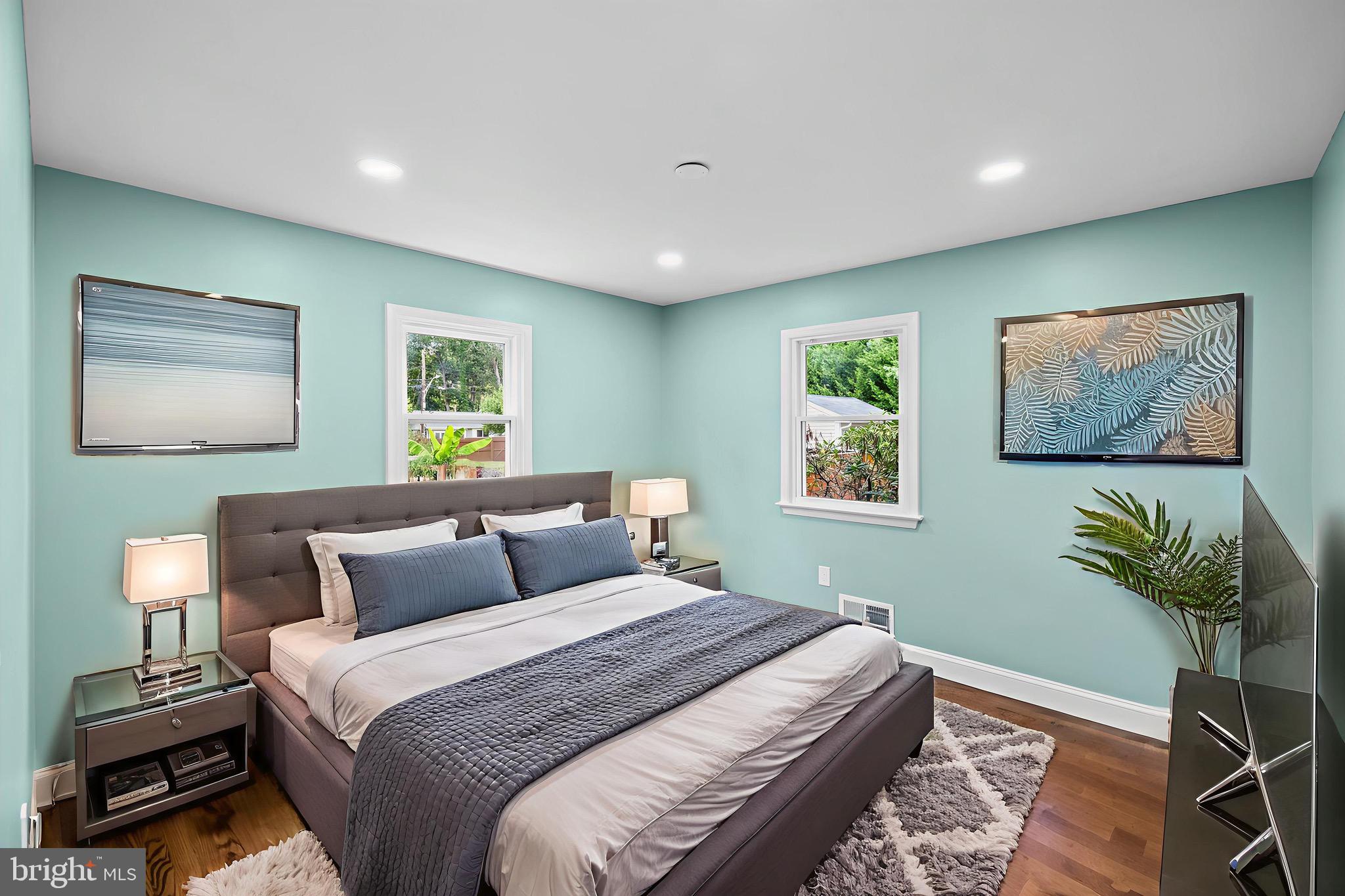 523 Sunset Knoll Road Pasadena, MD 21122 - Photo 19 of 60 a bedroom with a bed and a painting on the wall