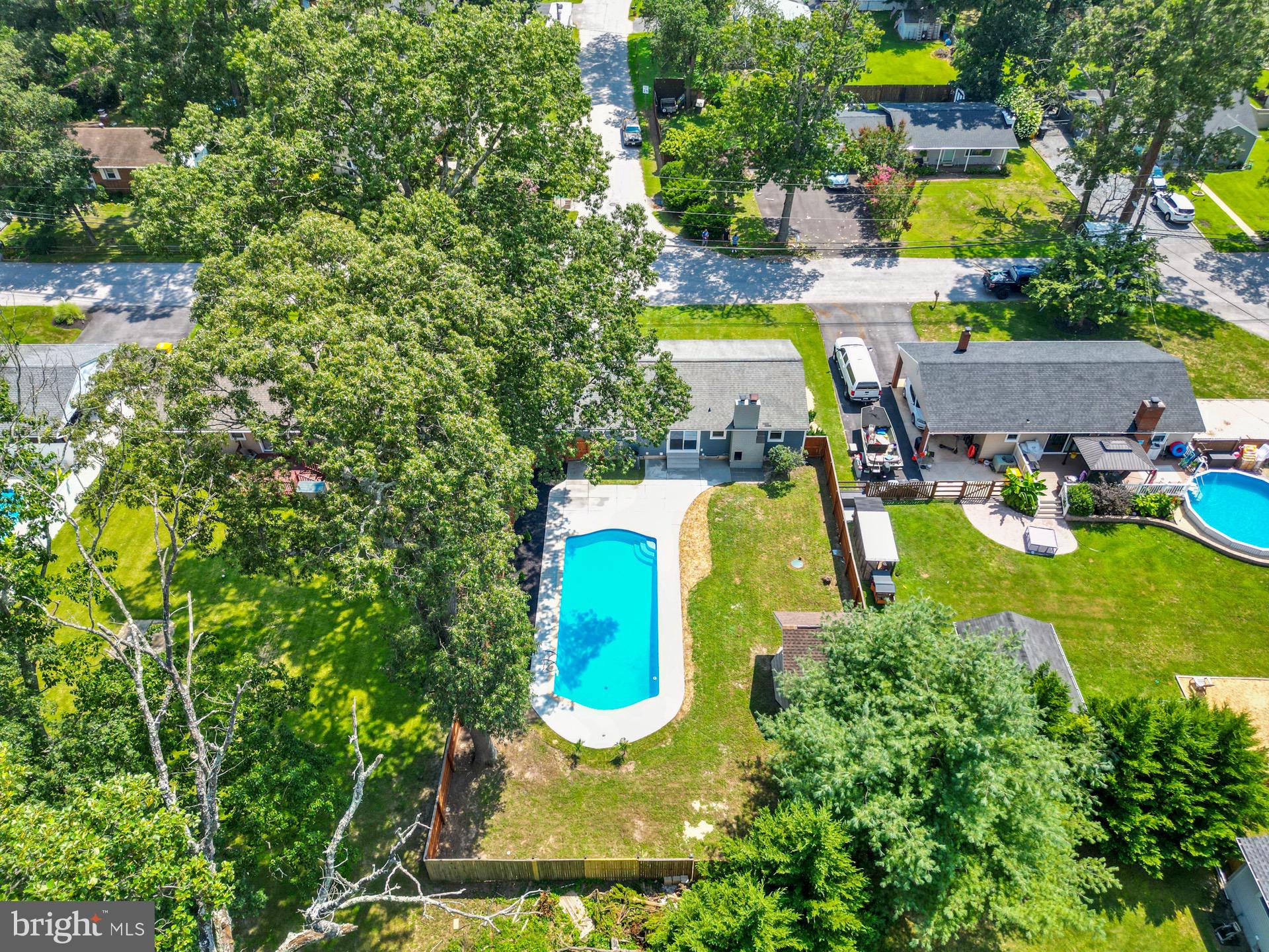523 Sunset Knoll Road Pasadena, MD 21122 - Photo 30 of 60 an aerial view of a house with swimming pool a yard and lake view