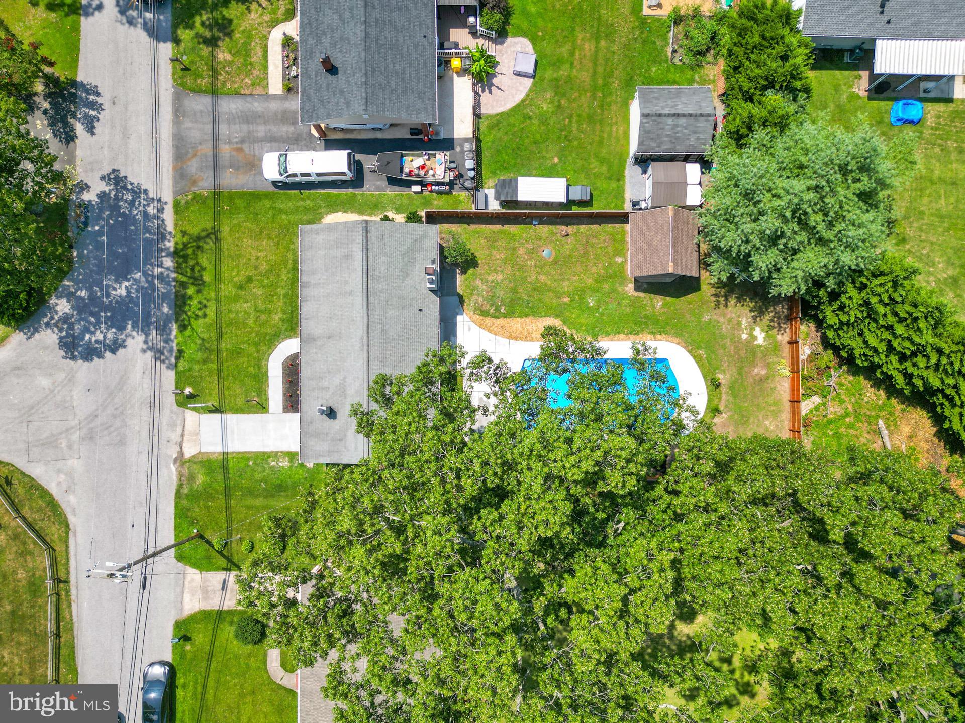 523 Sunset Knoll Road Pasadena, MD 21122 - Photo 34 of 60 an aerial view of a house with a garden and lake view