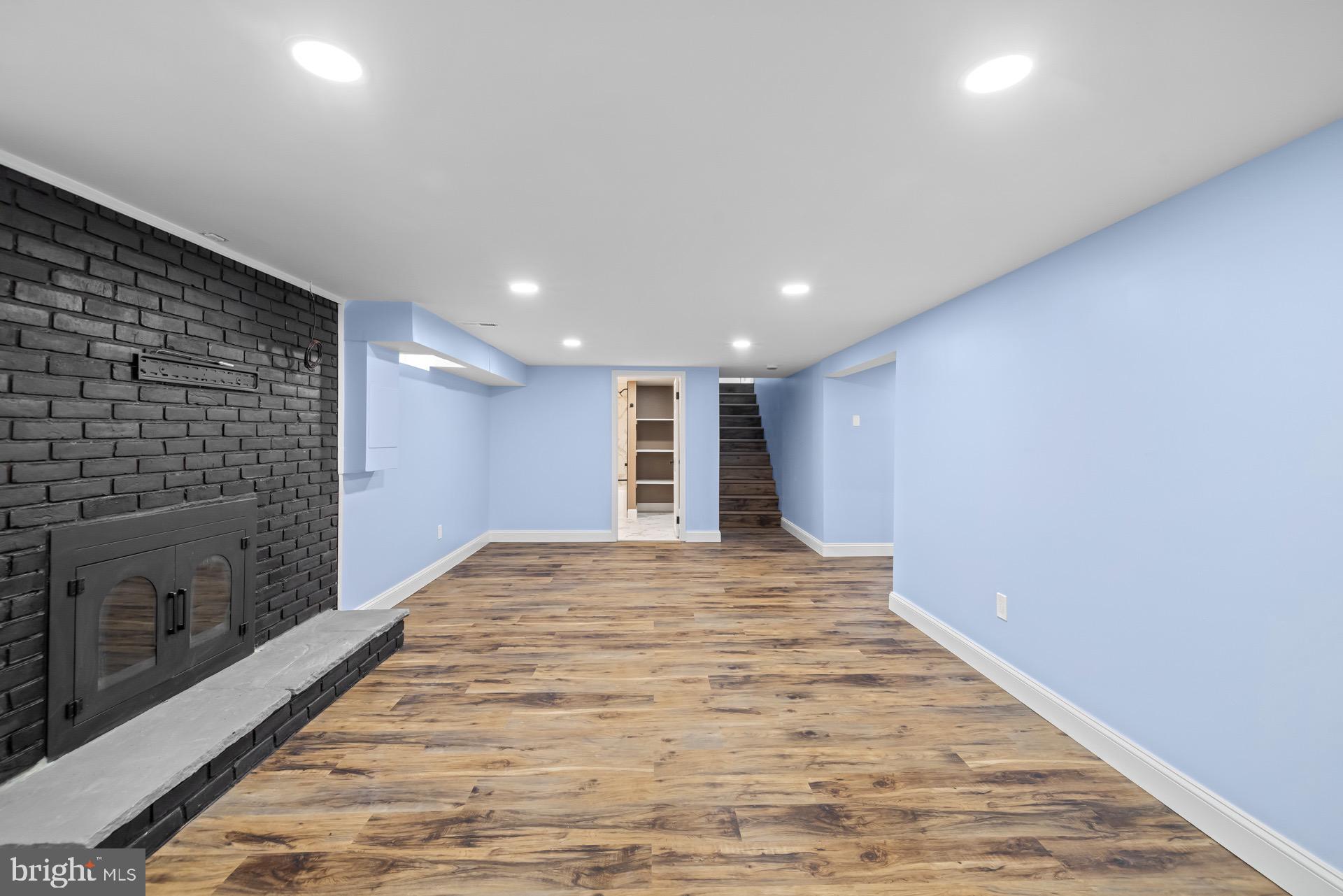 523 Sunset Knoll Road Pasadena, MD 21122 - Photo 43 of 60 a view of hallway with a fireplace