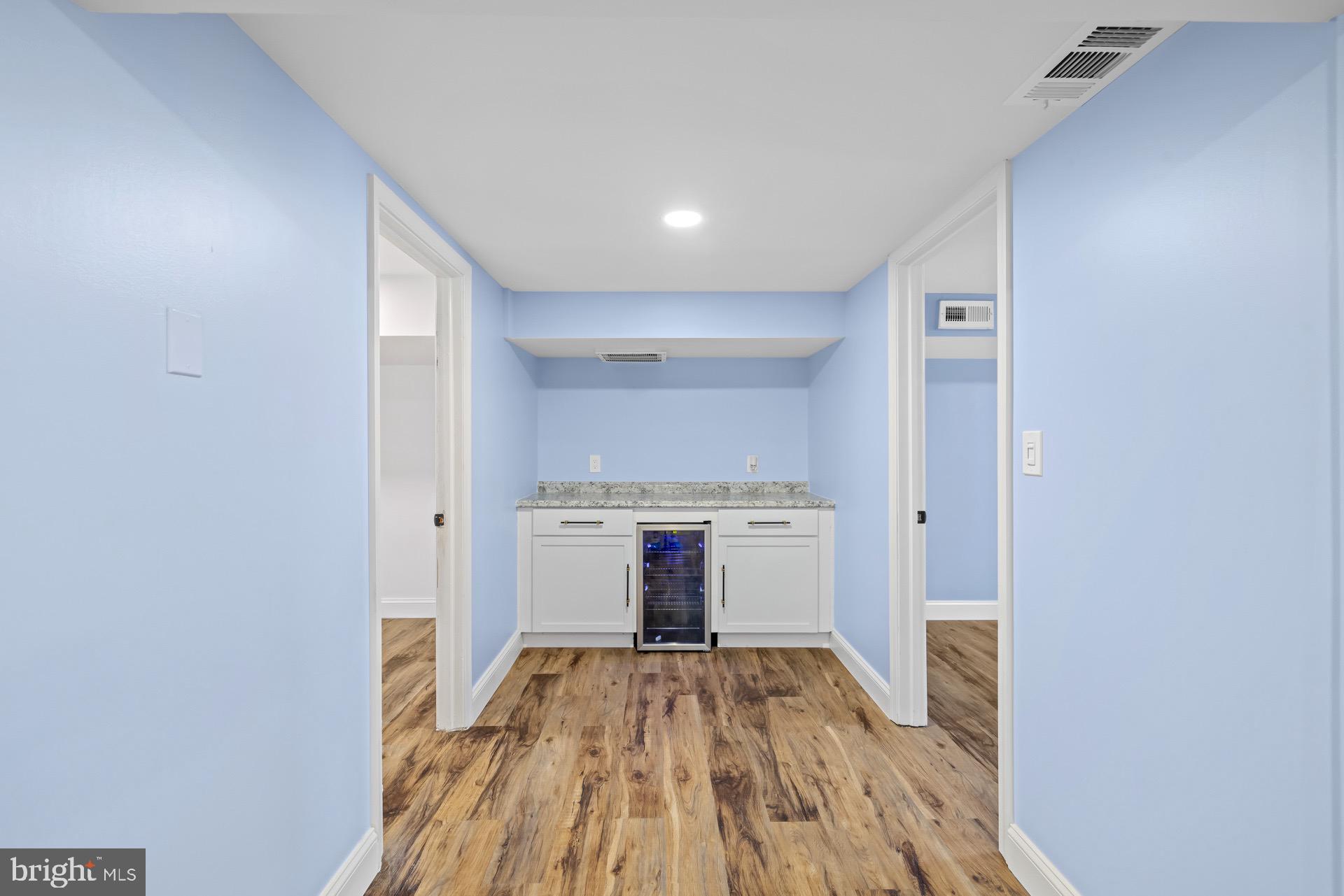 523 Sunset Knoll Road Pasadena, MD 21122 - Photo 45 of 60 a view of a kitchen with wooden floor and a sink