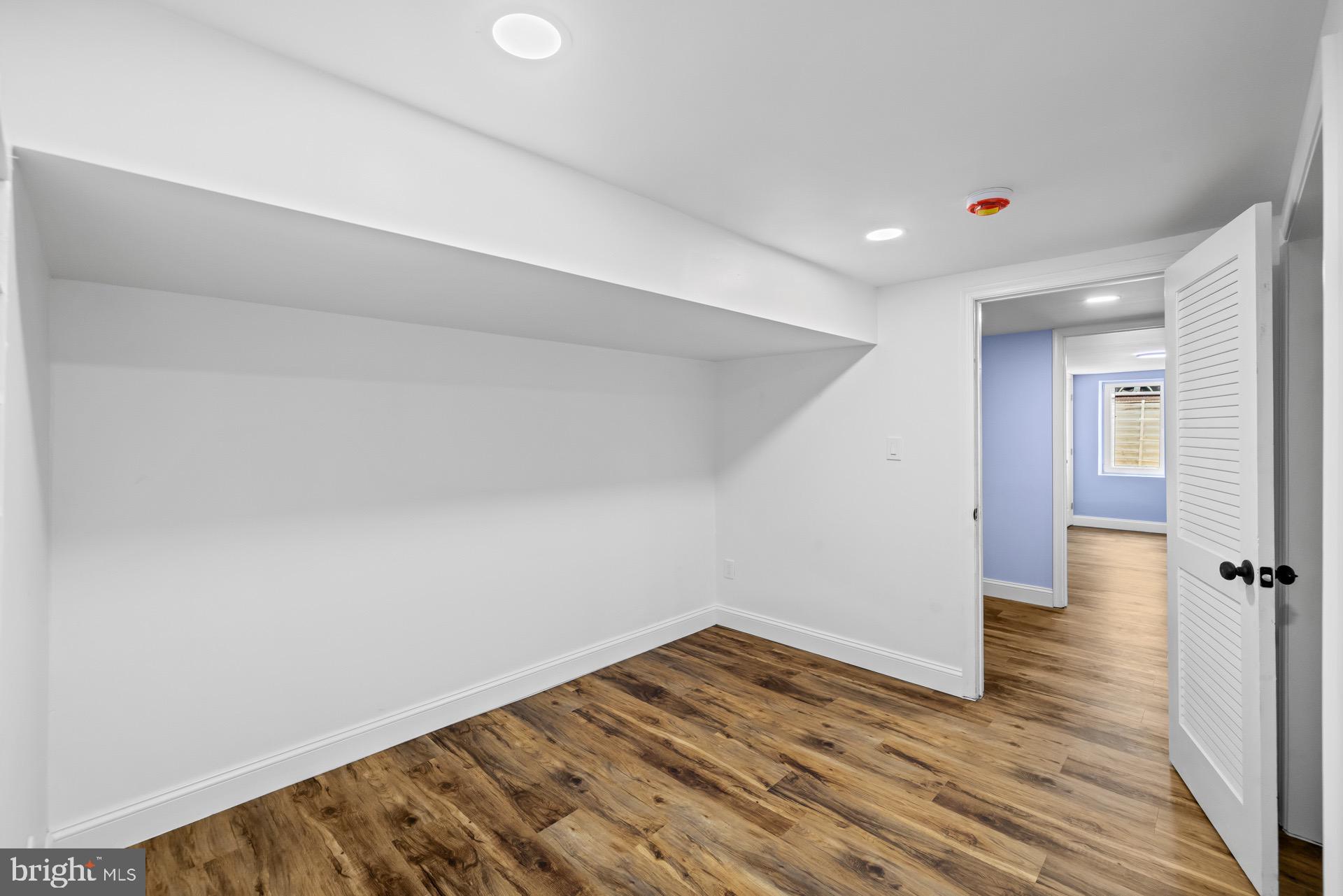 523 Sunset Knoll Road Pasadena, MD 21122 - Photo 50 of 60 a view of a room with wooden floor