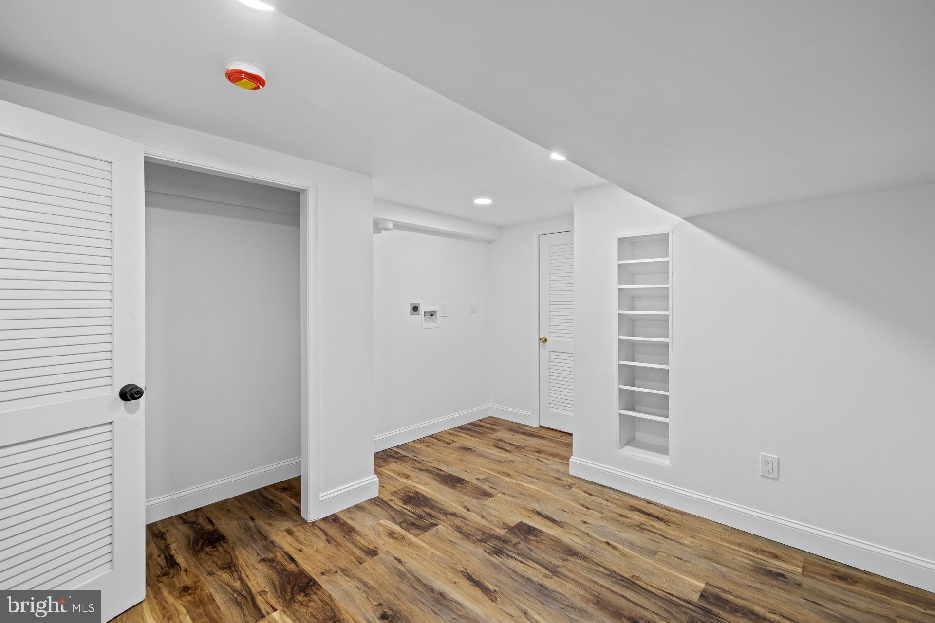 523 Sunset Knoll Road Pasadena, MD 21122 - Photo 51 of 60 a view of empty room with wooden floor and fan