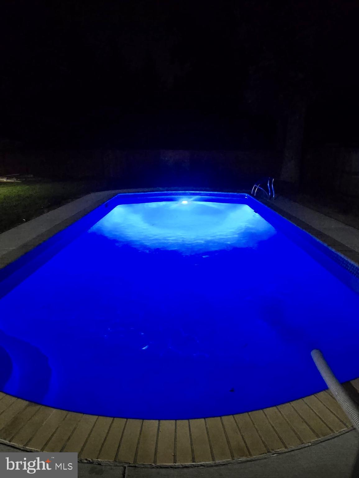 523 Sunset Knoll Road Pasadena, MD 21122 - Photo 58 of 60 a view of a big yard with swimming pool table and chairs