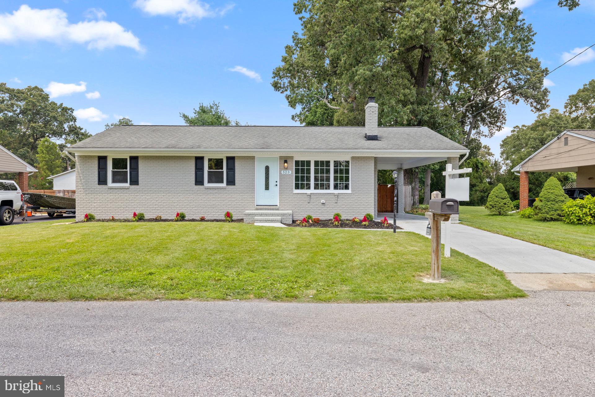 523 Sunset Knoll Road Pasadena, MD 21122 - Photo 59 of 60 a front view of a house with a garden
