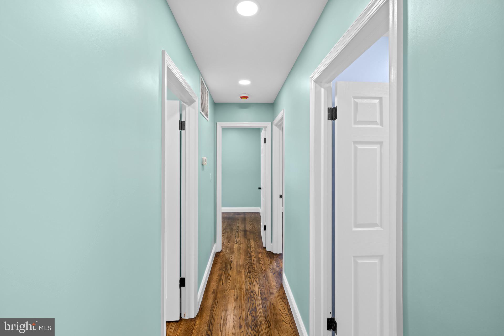 523 Sunset Knoll Road Pasadena, MD 21122 - Photo 8 of 60 a view of a hallway with a wooden door