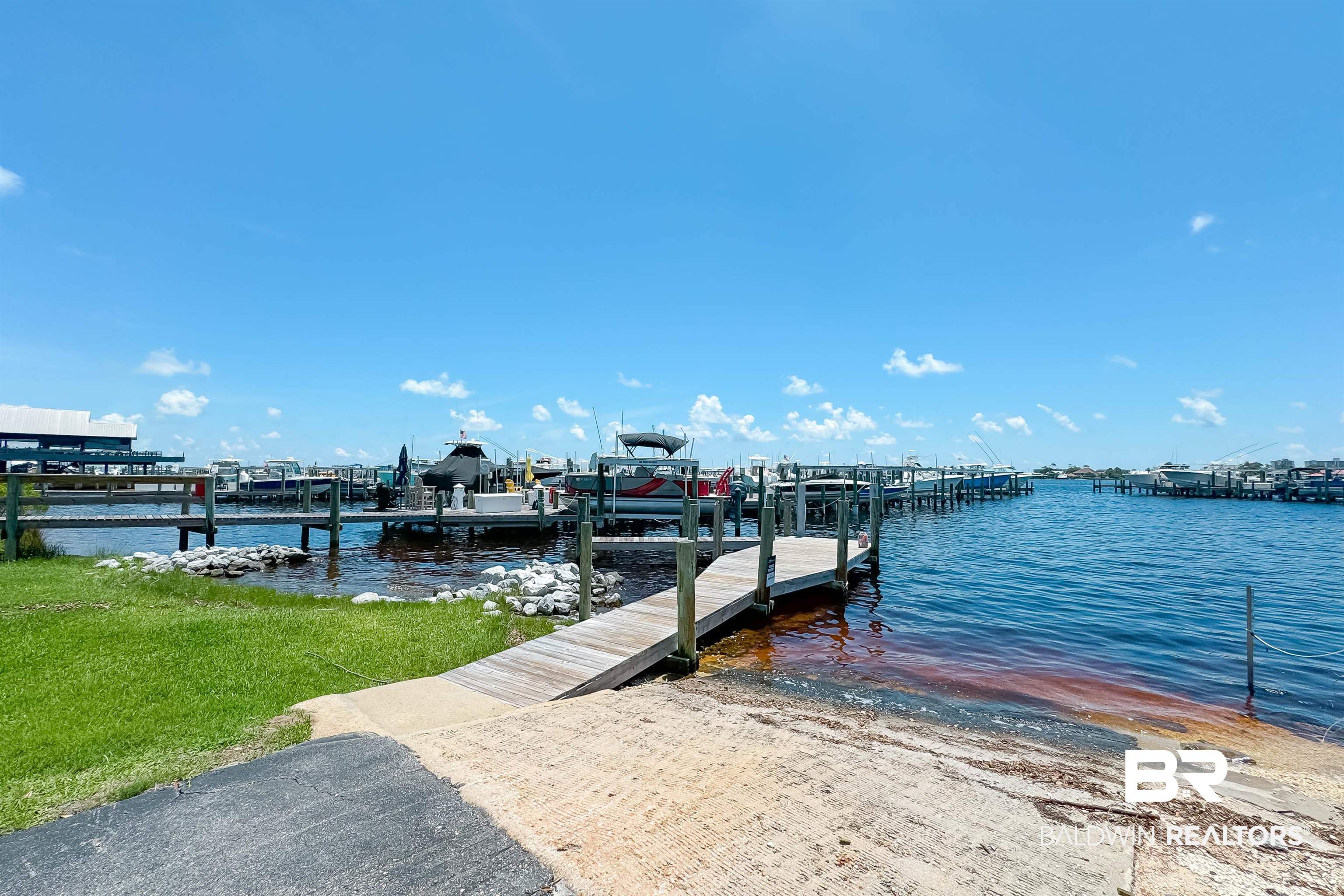27282 Canal Road, Unit 110 Orange Beach, AL 36561 - Photo 43 of 62 View of dock with a water view