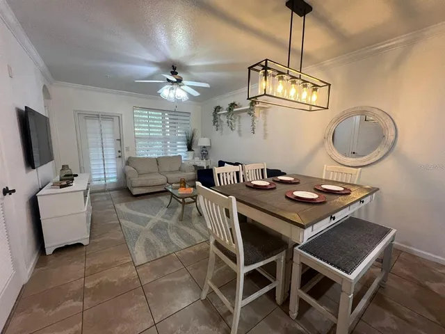 a view of a livingroom with furniture and a chandelier