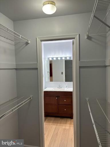 6803 Wild Rose Court Springfield, VA 22152 - Photo 25 of 49 a bathroom with a sink and mirror
