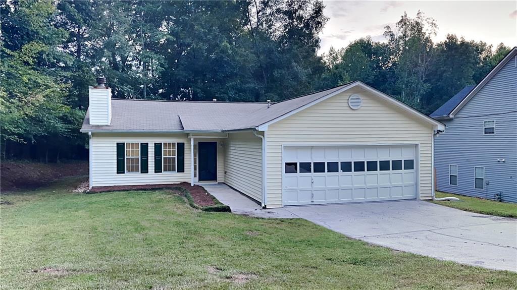 381 McDonough Road Hampton, GA 30228 - Photo 1 of 1 a view of a house with a yard and large tree