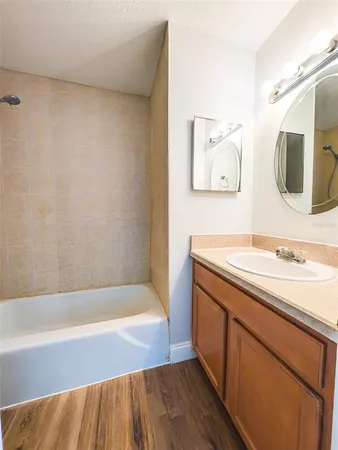 a bathroom with a sink and a bathtub