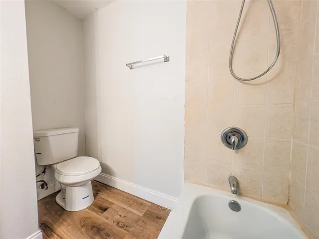 a bathroom with a toilet and a sink