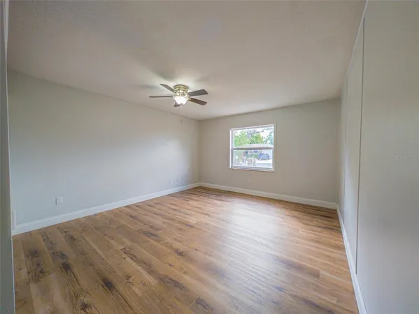 a view of an empty room with a window