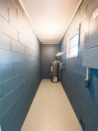 a view of an empty room with a large window