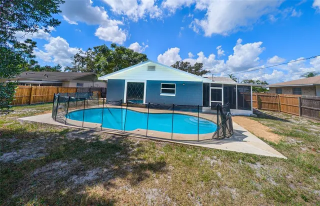 a view of a house with a backyard