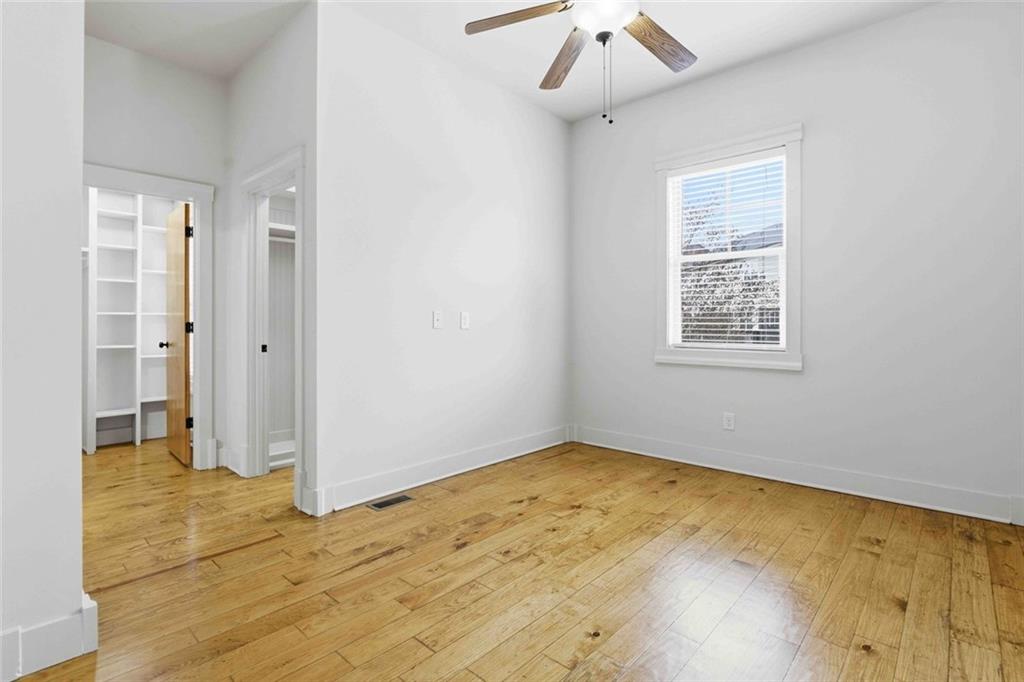 501 Ridge View Crossing Woodstock, GA 30188 - Photo 26 of 44 a view of empty room with wooden floor and fan