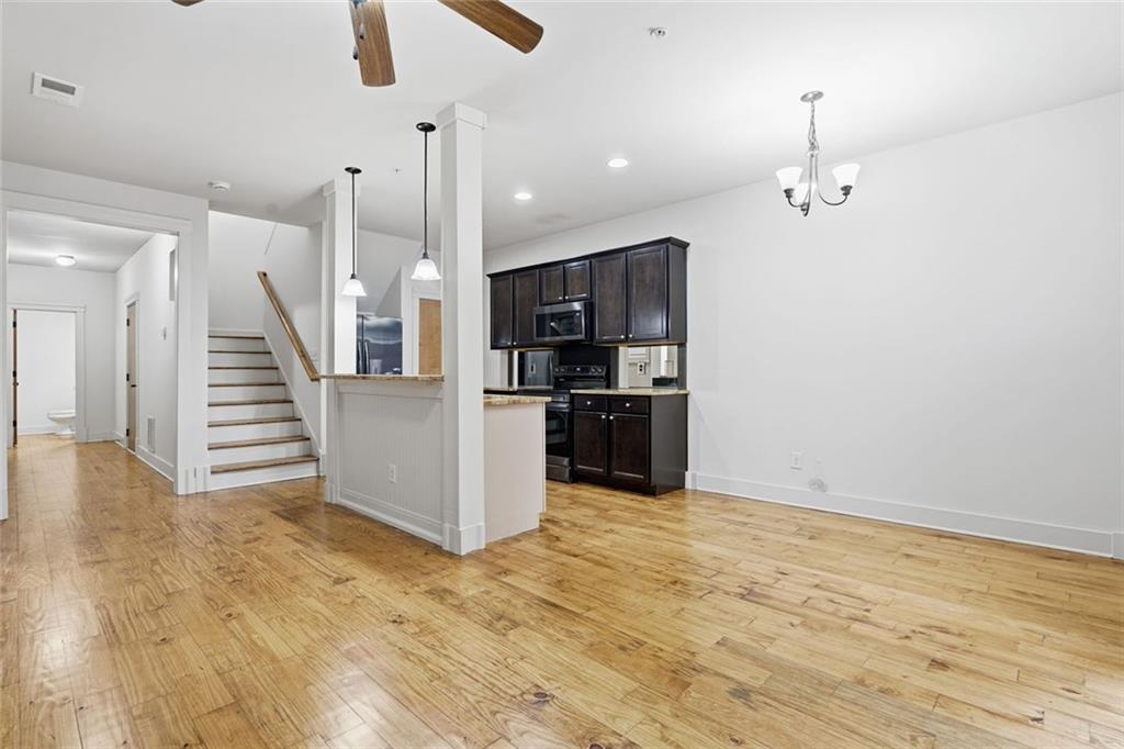 501 Ridge View Crossing Woodstock, GA 30188 - Photo 9 of 44 a view of kitchen and closet with wooden floor