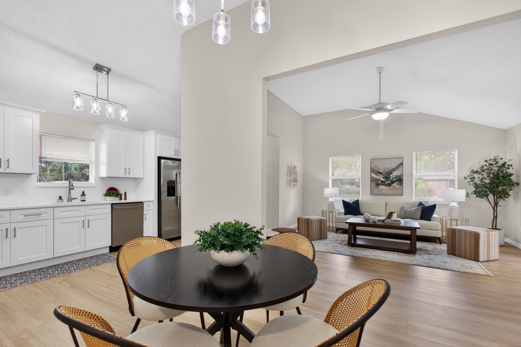 37 Madeore Street St. Augustine, FL 32084 - Photo 17 of 45 Dining space with light vinyl plank floors, ceiling fan, and high vaulted ceiling