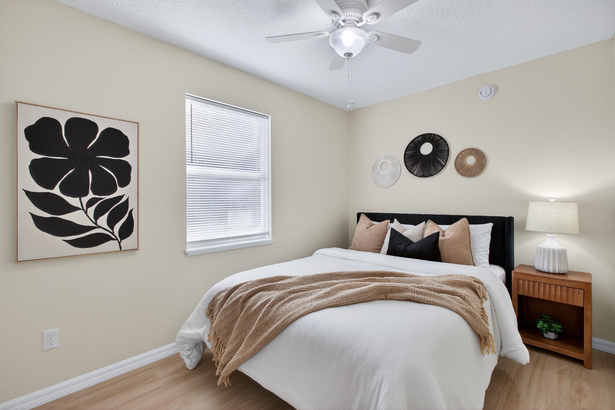 37 Madeore Street St. Augustine, FL 32084 - Photo 36 of 45 Bedroom with ceiling fan, vinyl plank floors, and a textured ceiling.