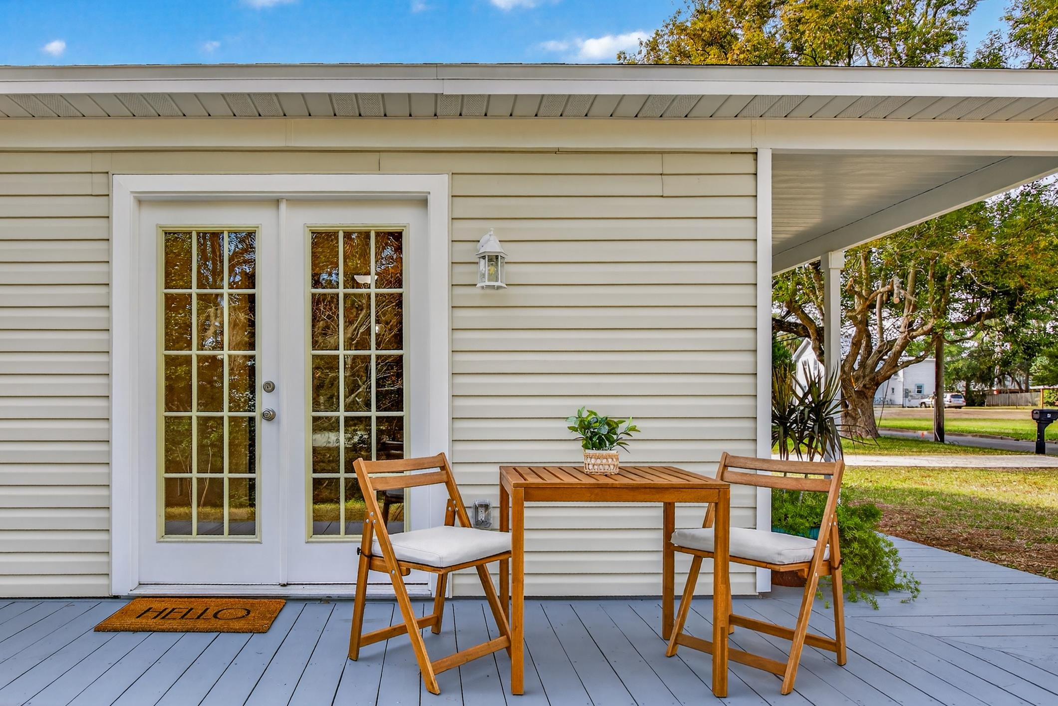 37 Madeore Street St. Augustine, FL 32084 - Photo 41 of 45 Wooden terrace featuring french doors and outdoor dining space.