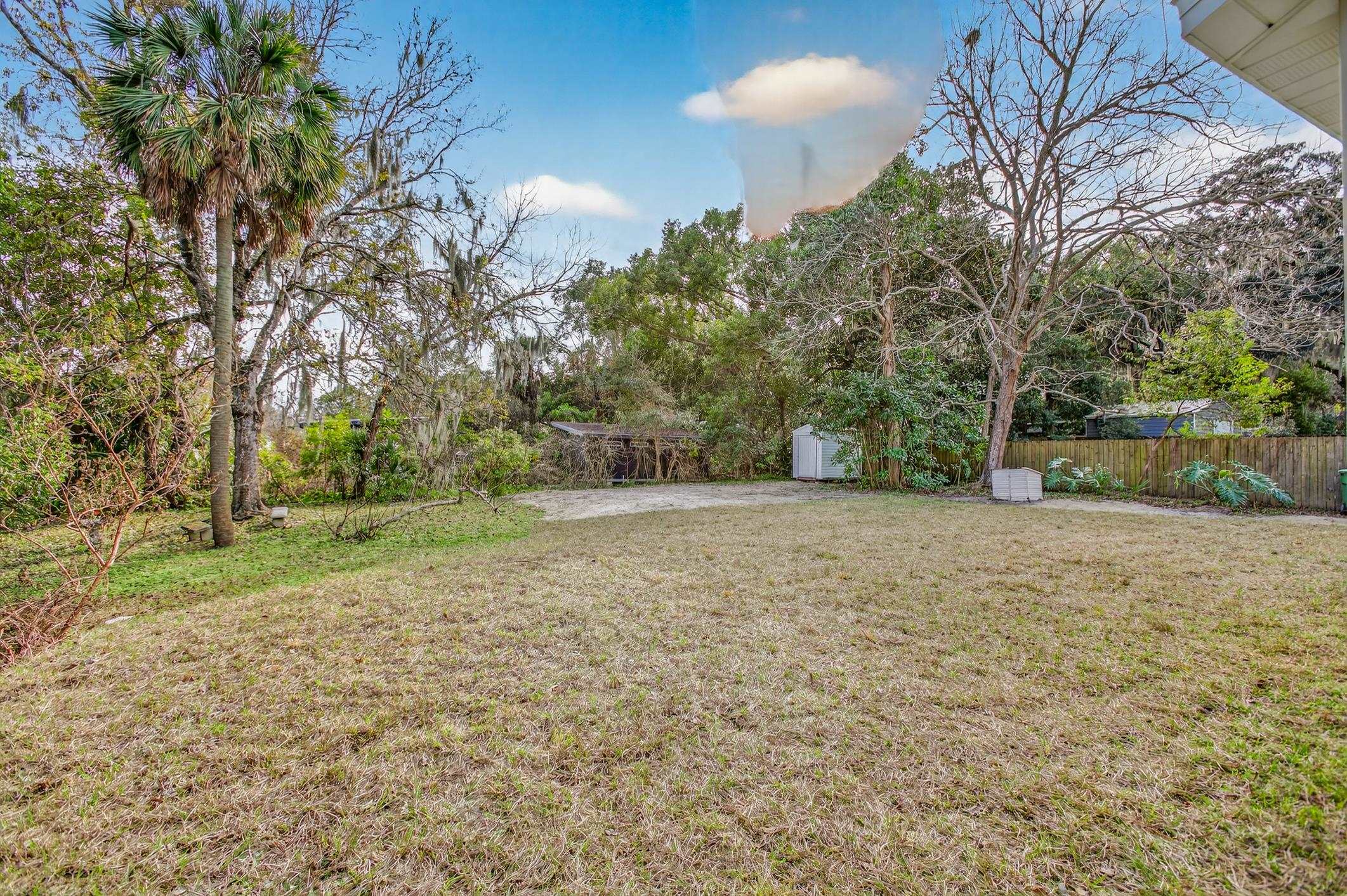 37 Madeore Street St. Augustine, FL 32084 - Photo 42 of 45 Fenced backyard with a storage shed and view of wooded area.