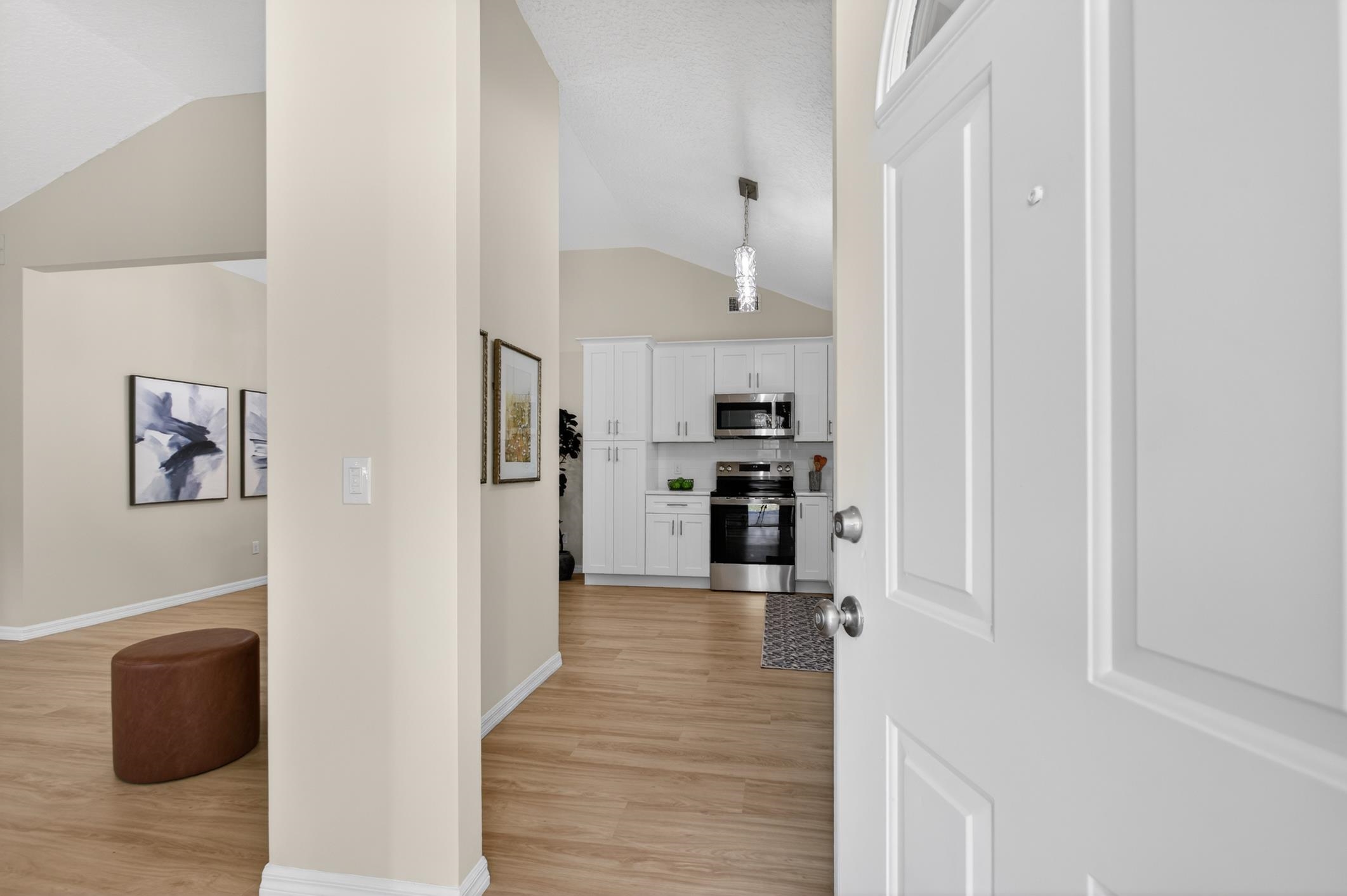 37 Madeore Street St. Augustine, FL 32084 - Photo 7 of 45 Entry hall with high ceilings and light vinyl plank floors welcomes you home.