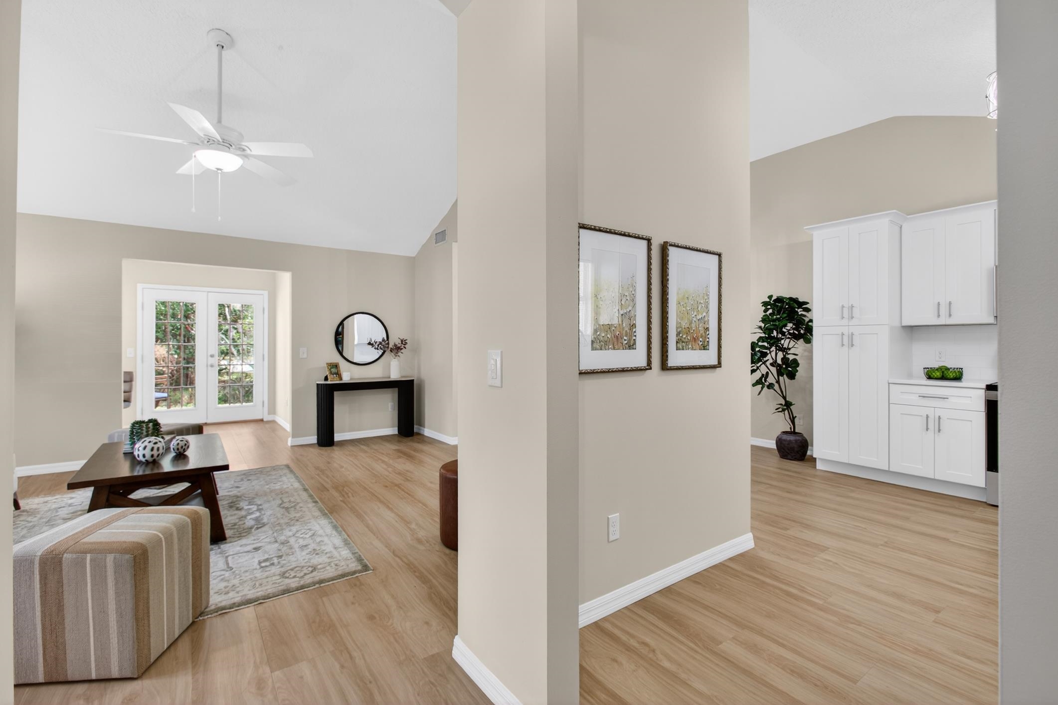 37 Madeore Street St. Augustine, FL 32084 - Photo 8 of 45 Living room featuring light vinyl plank floors, high vaulted ceiling, and ceiling fan