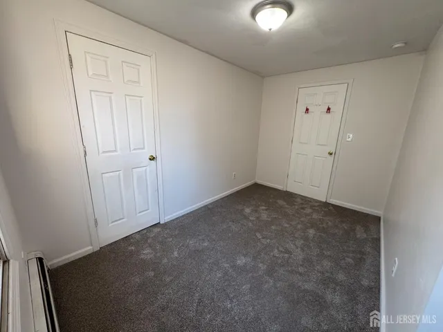 an empty room with closet area