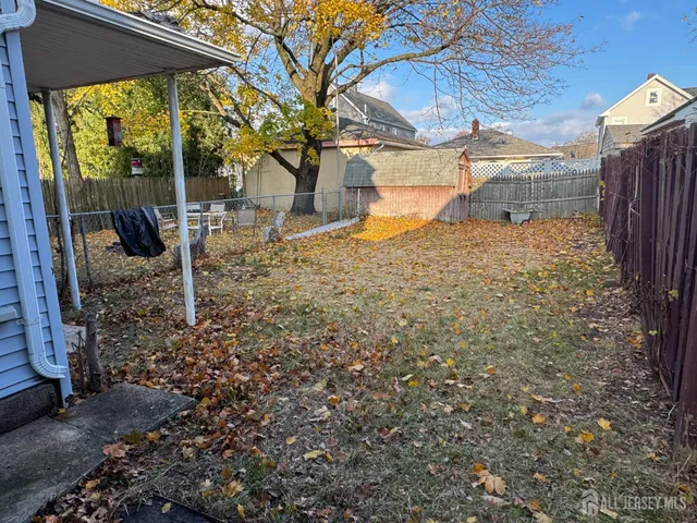 a view of a yard with a tree