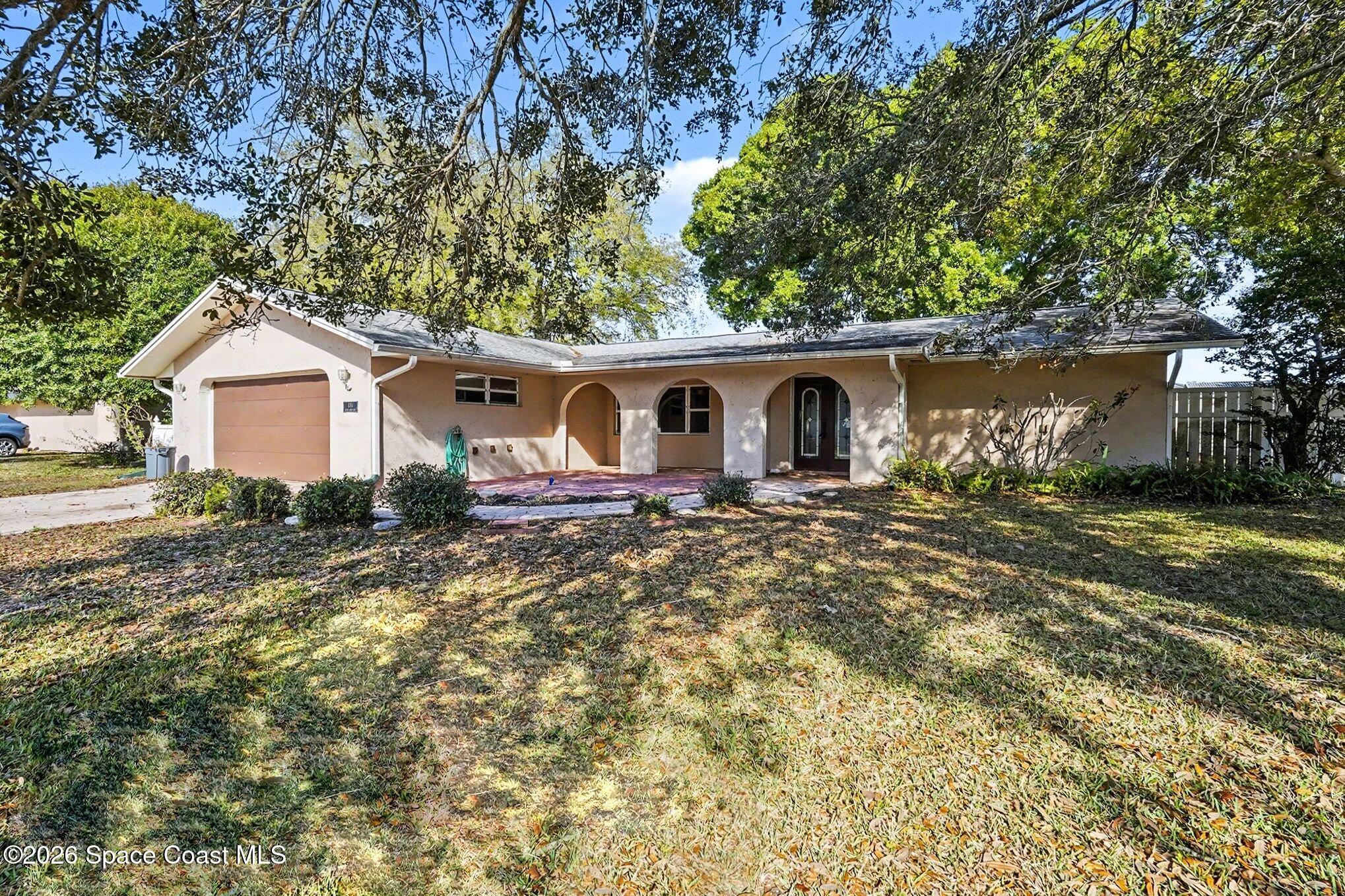1351 Cherry Hills Road Northeast Palm Bay, FL 32905 - Photo 14 of 15 Nestled among beautiful mature trees!