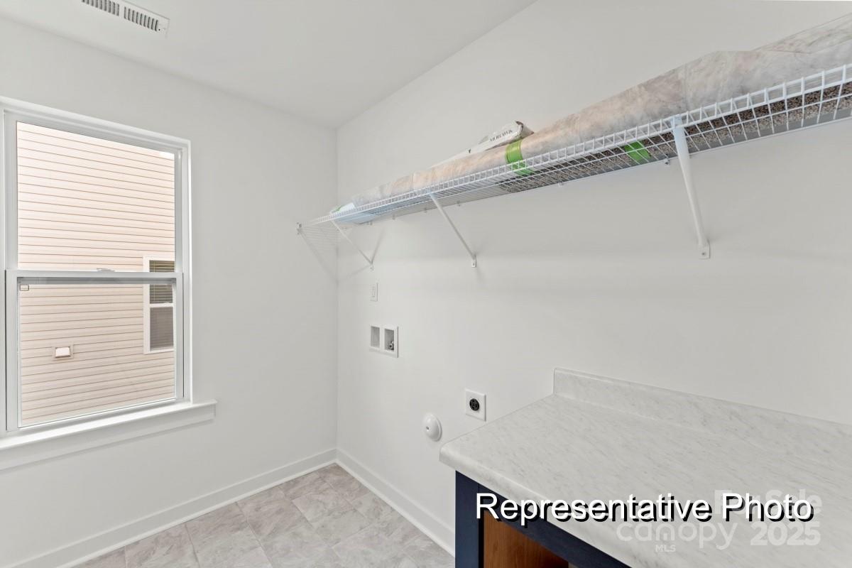 32612 B Millingport Road, Unit 7157 New London, NC 28127 - Photo 23 of 23 a view of a room with racks on the wall