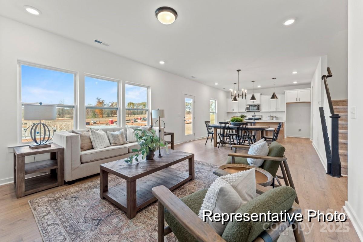 32612 B Millingport Road, Unit 7157 New London, NC 28127 - Photo 5 of 23 a living room with furniture and a dining table
