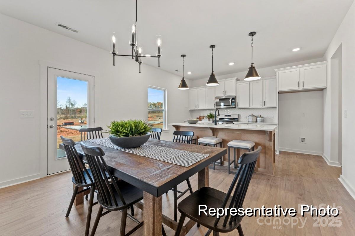 32612 B Millingport Road, Unit 7157 New London, NC 28127 - Photo 8 of 23 a view of a dining room and livingroom