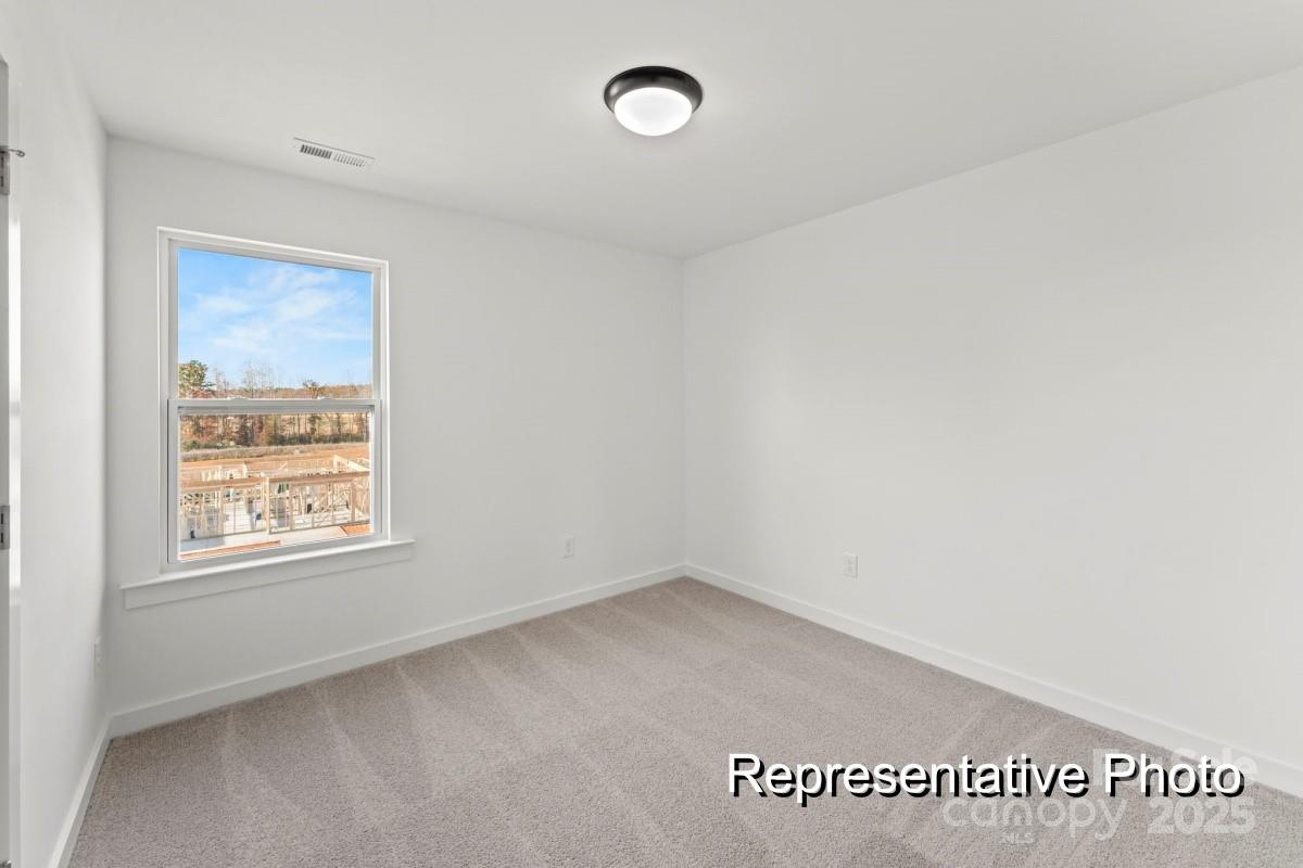 32612 B Millingport Road, Unit 7157 New London, NC 28127 - Photo 10 of 23 an empty room with a window