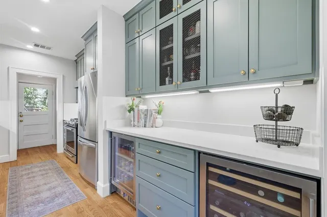 a kitchen with a sink and cabinets