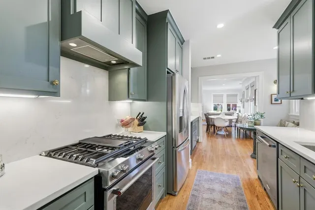 a kitchen with a stove and cabinets