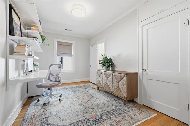 a living room with furniture and a rug