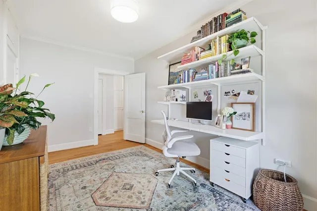 a workspace with furniture and window