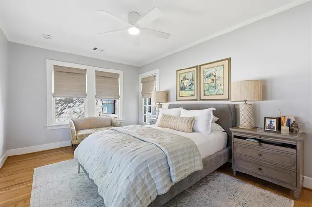 a bedroom with bed and window