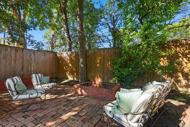 a view of patio with couple of chairs
