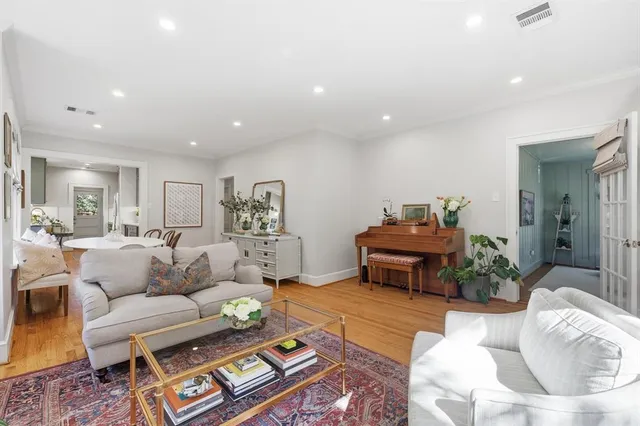 a living room with furniture and a table