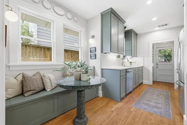 a spacious bathroom with a granite countertop tub sink and mirror