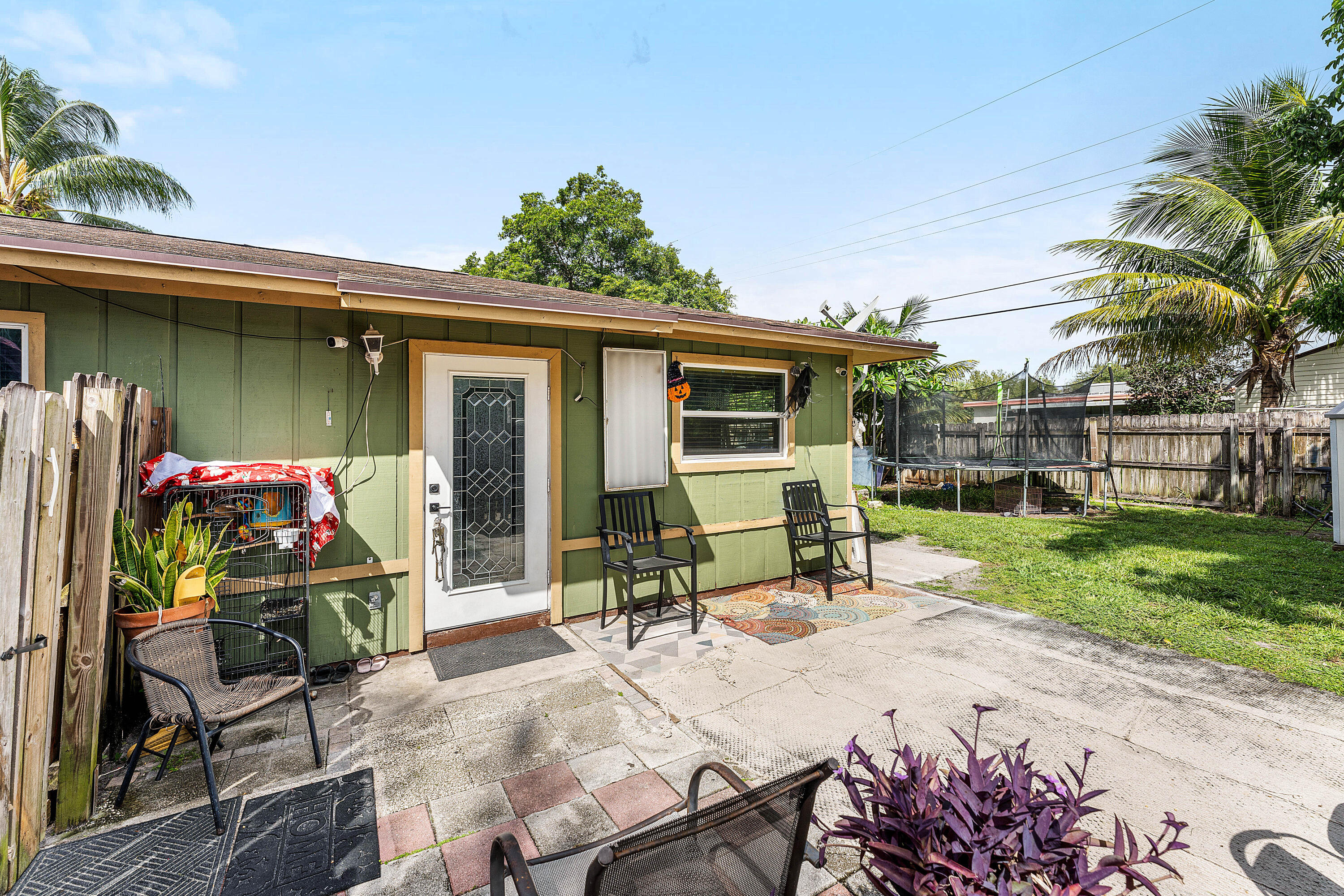 2907 Apalachee Road Palm Springs, FL 33406 - Photo 25 of 27 a view of a patio with a table and chairs in patio