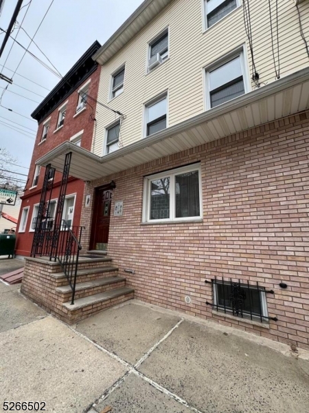 158 Lafayette Street, Unit 2 Newark, NJ 07105 - Photo 15 of 16 a front view of a house with stairs