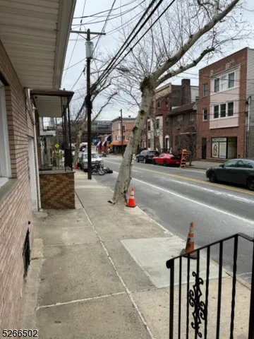 a view of a building with car parked