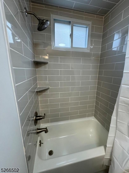 158 Lafayette Street, Unit 2 Newark, NJ 07105 - Photo 6 of 16 a bathroom with a bathtub
