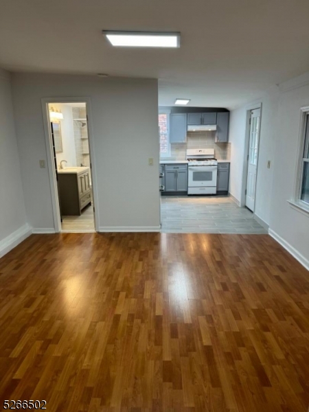 158 Lafayette Street, Unit 2 Newark, NJ 07105 - Photo 8 of 16 a view of a kitchen cabinets and wooden floor
