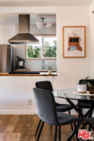a dining room with furniture and a window