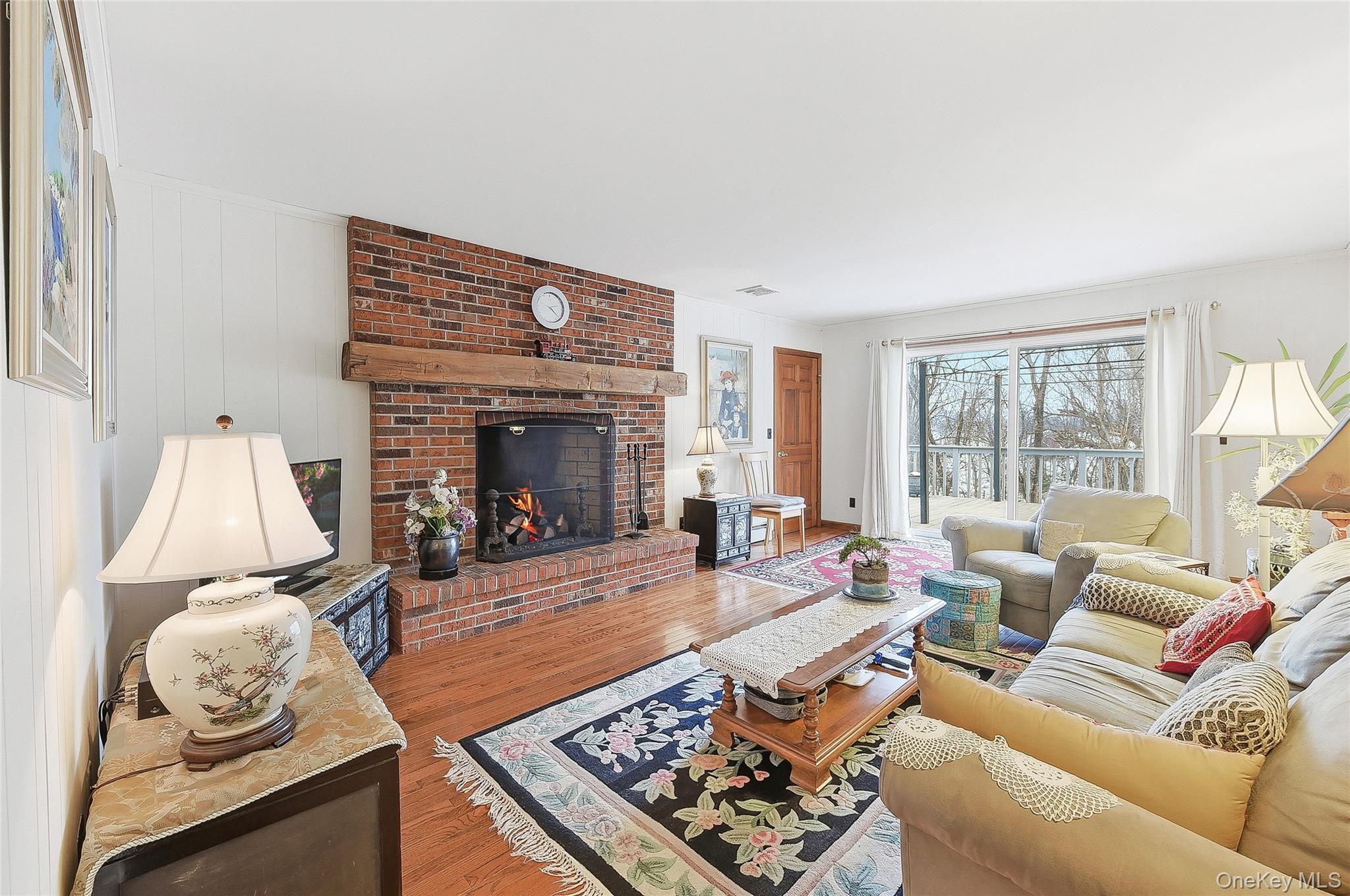 183 High Meadows Road Walden, NY 12586 - Photo 17 of 44 Family room featuring a brick fireplace and wood finished floors