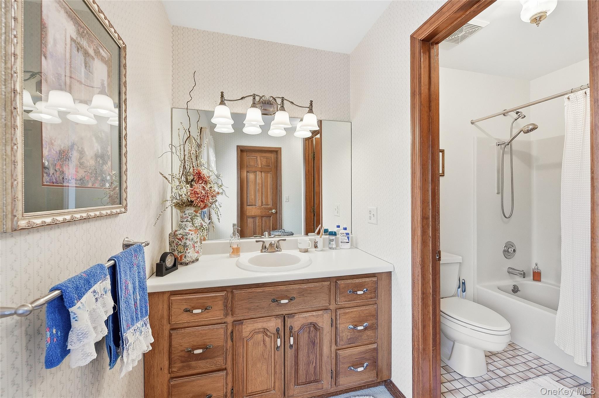 183 High Meadows Road Walden, NY 12586 - Photo 25 of 44 Full bath featuring vanity, shower / bath combo, wallpapered walls, and light tile patterned flooring